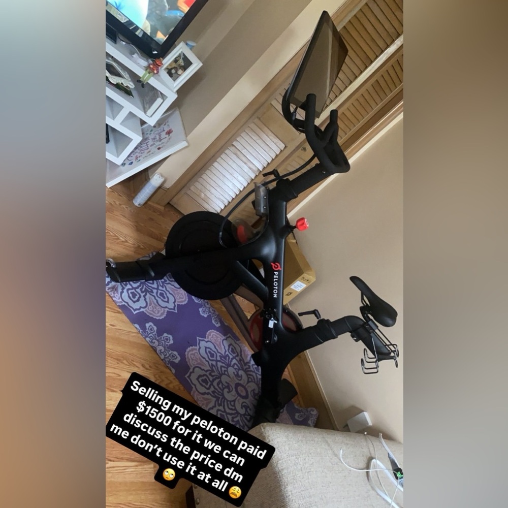 Peloton Bike with Black & Red Accents used 3 times brand new it’s wasting space